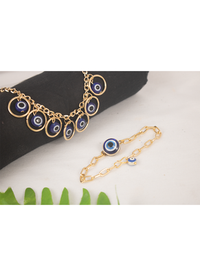 Stylish gold plated combo of evil eye protective rakhi for bhaiya bhabhi with roli chawal and written greeting note. 2