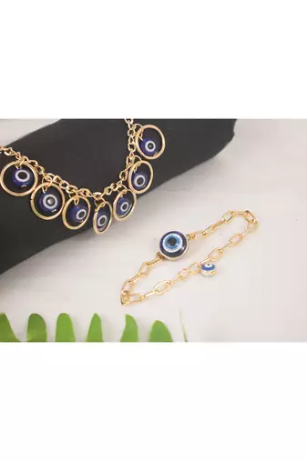 Stylish gold plated combo of evil eye protective rakhi for bhaiya bhabhi with roli chawal and written greeting note.