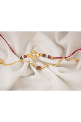 Combo of gold plated kundan couple pair rakhi raksha bandhan  with roli chawal and written greeting note.