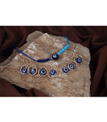 Handcrafted combo of evil eye protective rakhi for bhaiya bhabhi with roli chawal and written greeting note.