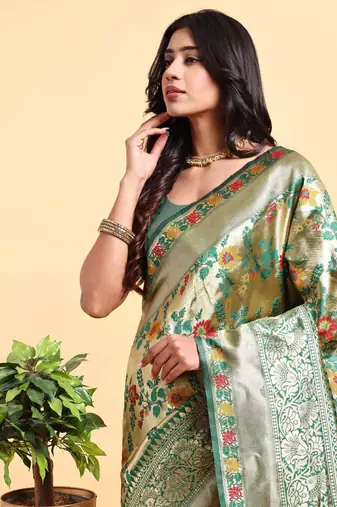Golden and green zari woven floral pattern saree with blouse piece