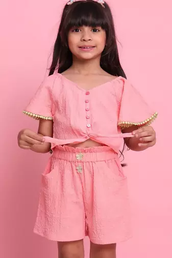 Girls' peach co-ord set     front-knot short sleeve top with matching shorts