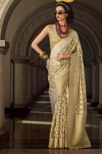 Cream tissue art silk with zari weaving wedding wear saree