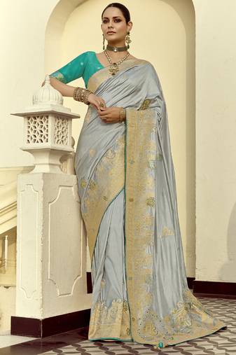 Light gray dola silk heavy zari weaving cut dana work and designer contrast blouse wedding sarees