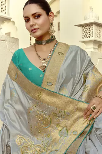 Light gray dola silk heavy zari weaving cut dana work and designer contrast blouse wedding sarees