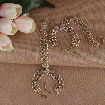 gold plated pearl hathphool set with floral & oval design  1