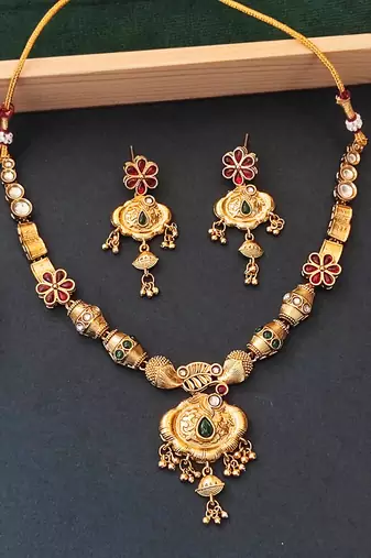 Ethnic gold floral necklace set with red and green enamel accents