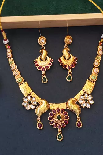 Peacock inspired ethnic necklace set with floral and stone detailing