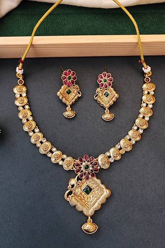Floral pendant antique necklace set with ruby and green stones