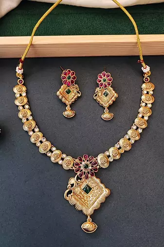 Floral pendant antique necklace set with ruby and green stones