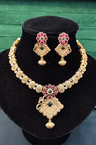 Floral pendant antique necklace set with ruby and green stones
