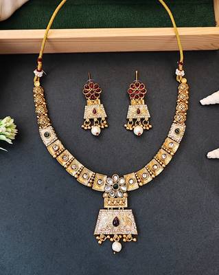 Temple inspired bell pendant necklace set with pearl drops 1