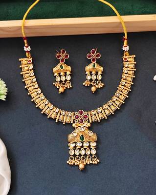 Traditional floral pendant necklace set with red and green stones and dangling beads 1