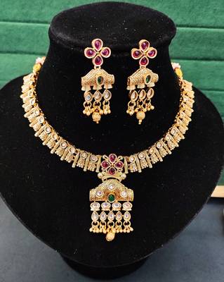 Traditional floral pendant necklace set with red and green stones and dangling beads 3