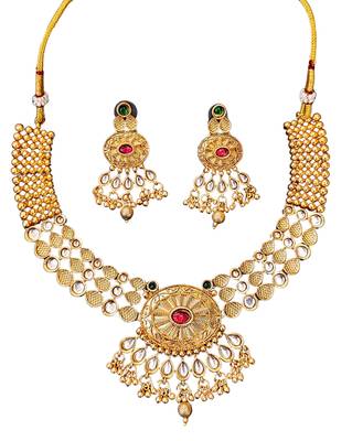 Beautiful gold-plated kundan necklace and earrings set with red and green stones, pearl accents for her 4