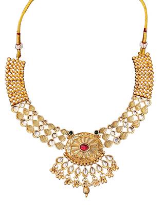 Beautiful gold-plated kundan necklace and earrings set with red and green stones, pearl accents for her 5