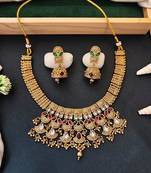 Traditional kundan choker necklace set with red and green stones, gold-plated jhumka earrings
