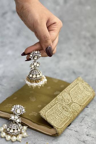 Gold plated white kundan earrings