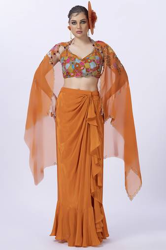 Orange embroidered organza blouse paired with dhoti & shrug