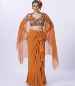 Orange embroidered organza blouse paired with dhoti & shrug