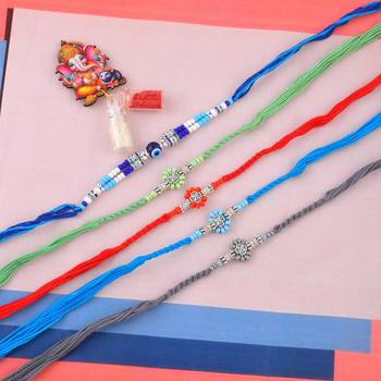 Rakhi for bhaiya bhabhi-pure silver charm 4 rakhi and one evil eye rakhi set (pack of 5) 1