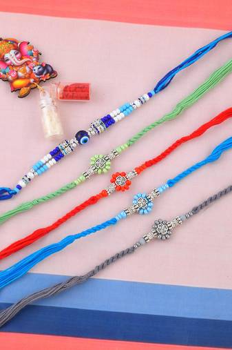 Rakhi for bhaiya bhabhi-pure silver charm 4 rakhi and one evil eye rakhi set (pack of 5)