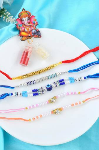Rakhi for bhaiya bhabhi-pearl, cz and evil eye rakhi set for rakshabandhan with silver coin (pack of 5)