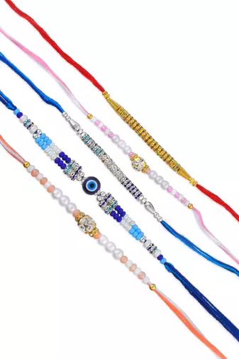 Rakhi for bhaiya bhabhi-pearl, cz and evil eye rakhi set for rakshabandhan with silver coin (pack of 5)