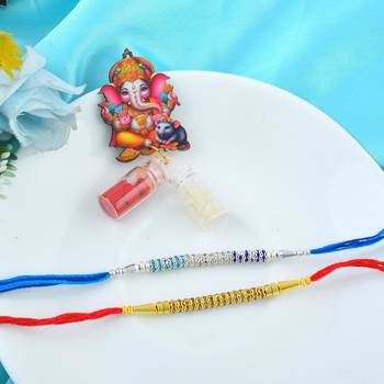 Rakhi for bhaiya bhabhi- imitation diamond rakhi with 50% silver content lakshmi ganesh coin (pack of 2) 1