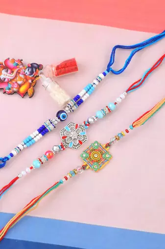 Pure silver and beaded traditional rakhi for bhaiya bhabhi for rakshabandhan (pack of 3)