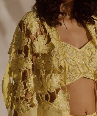 Yellow plain organza pant paired with embroidered blouse and cape 5
