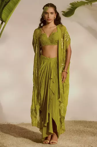 Green plain organza pant paired with embroidered blouse and cape