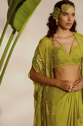 Green plain organza pant paired with embroidered blouse and cape