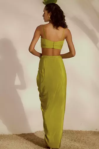 Green plain organza pant paired with embroidered blouse and cape