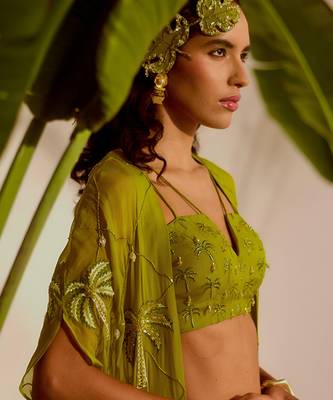 Green plain organza pant paired with embroidered blouse and cape 5