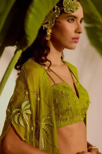 Green plain organza pant paired with embroidered blouse and cape