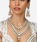 Gold-plated kundan bridal necklace set with pearls & green stones traditional indian jewelry for weddings & festive wear