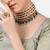 Gold-plated kundan choker necklace set with green beads & statement ring – traditional indian jewelry for women