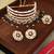 Gold-plated kundan choker necklace set with green beads & statement ring – traditional indian jewelry for women