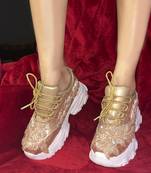 Gold leather embroidered sneakers