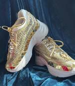 Gold leather embroidered sneakers