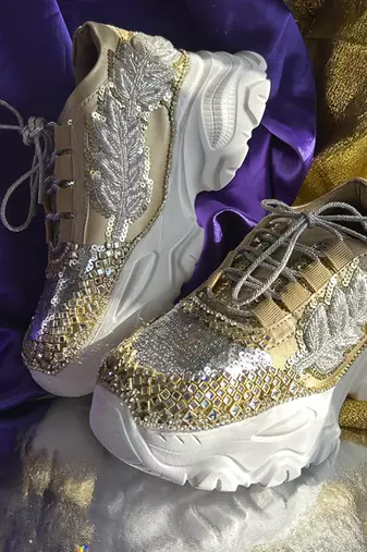 Gold leather embroidered sneakers