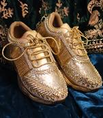 Gold leather embroidered sneakers