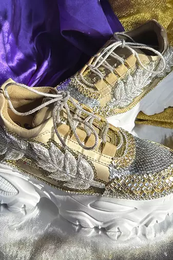 Gold leather embroidered sneakers