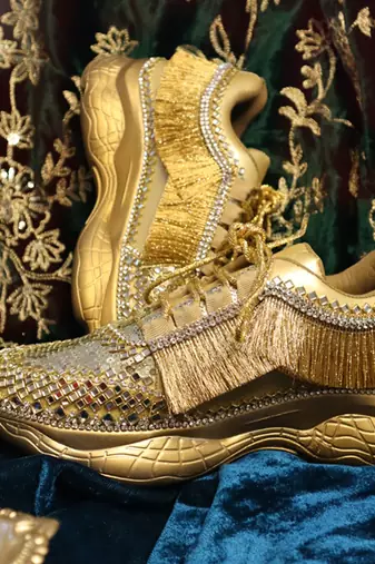 Gold leather embroidered sneakers