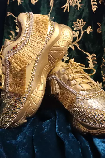 Gold leather embroidered sneakers