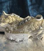 Gold leather embroidered sneakers