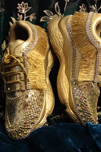Gold leather embroidered sneakers