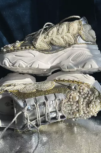Gold leather embroidered sneakers