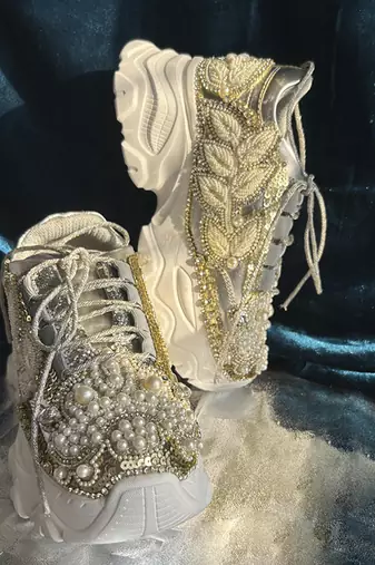 Gold leather embroidered sneakers